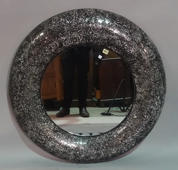 A modern circular glass and resin framed wall mirror, 96cm diameter.