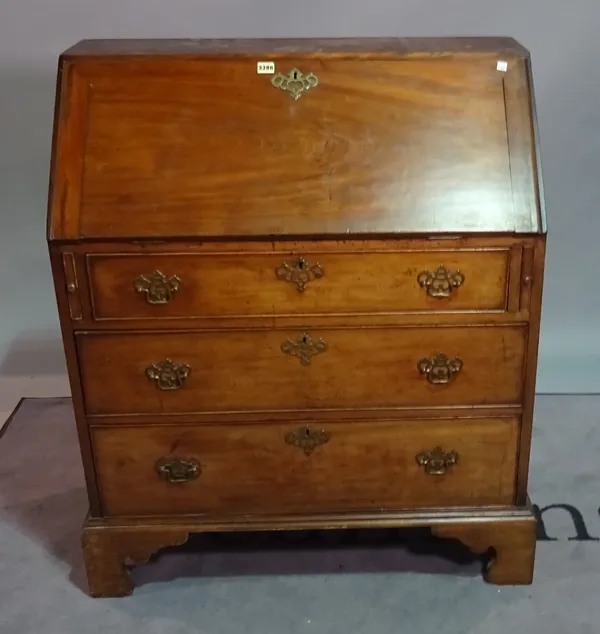 A 19th century mahogany bureau bookcase, the astragal glazed doors over three long graduated drawers on bracket feet, 67cm wide x 75cm high.