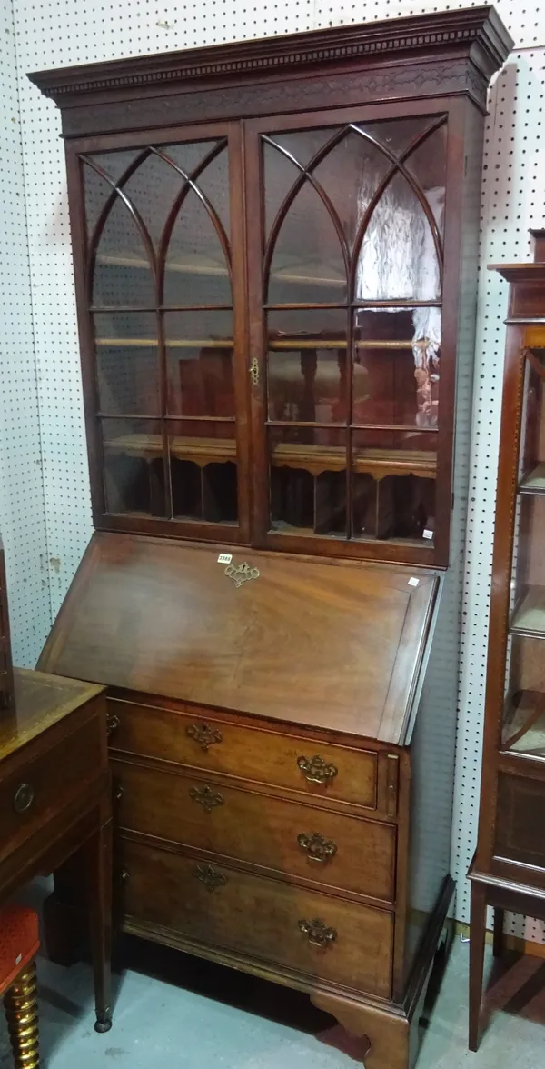 A late Victorian floor standing three tier open bookcase, on plinth base, 122cm wide x 110cm high.