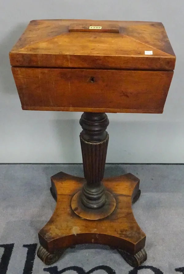 A George IV yew wood teapoy enclosing four lidded caddies on reeded column, 40cm wide x 77cm high.