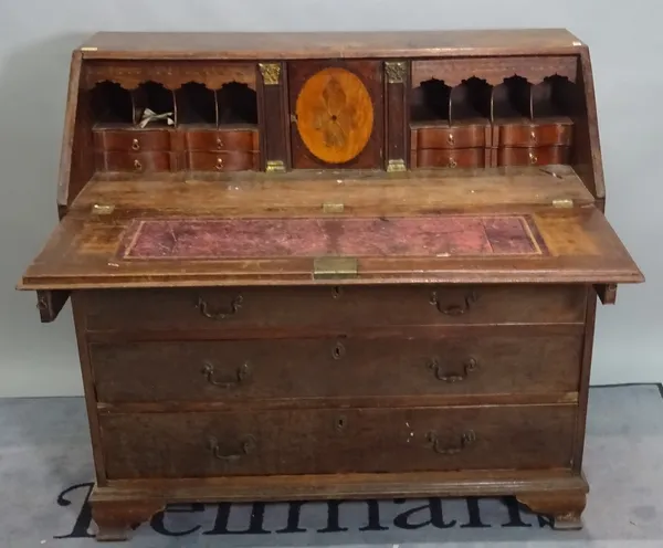 A mid-18th century mahogany bureau with fitted interior and ogee bracket feet, 112cm wide x 109cm high.