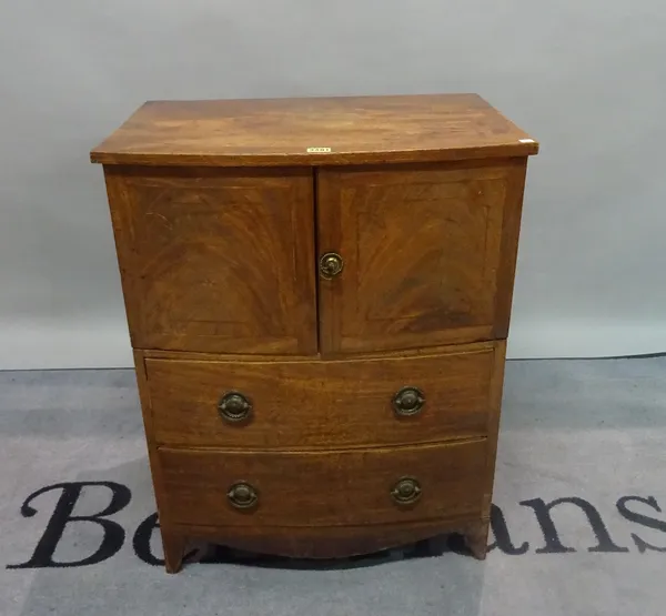 A Regency mahogany bowfront commode chest, with two short drawers on splayed bracket feet, 61cm wide x 76cm high.