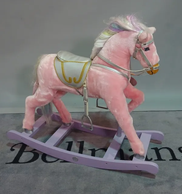 'Thoroughbred Horses', a modern pink upholstered child's rocking horse, 103cm wide x 84cm high.