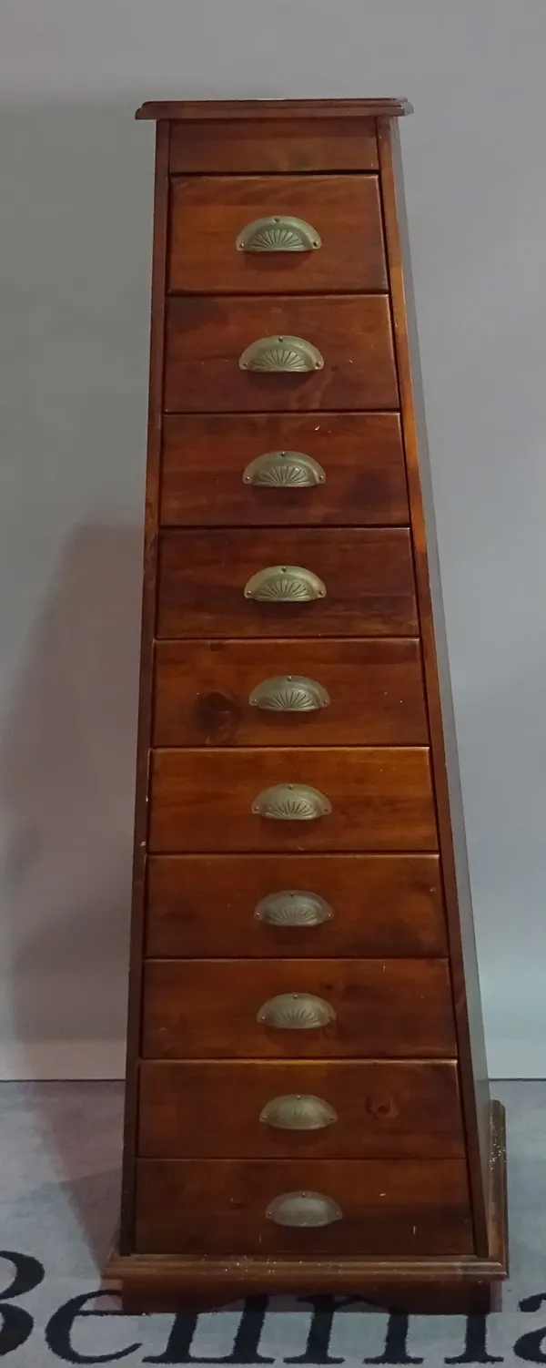 A modern stained beech chest, of ten graduated drawers, 52cm wide x 152cm high.