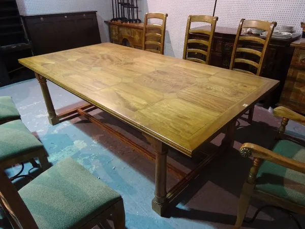 A modern oak and marble inlaid dining table, on turned block supports, 230cm long x 76cm high.