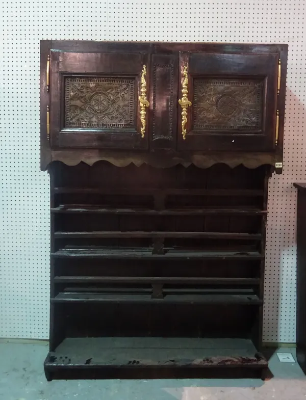 An 18th century and later oak dresser, the three tier plate rack over cupboard base, 120cm wide x 175cm high.