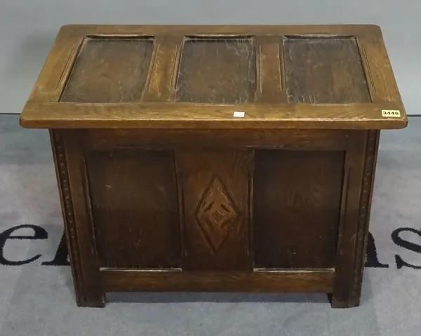 A small 17th century style oak three panel coffer, 68cm wide.