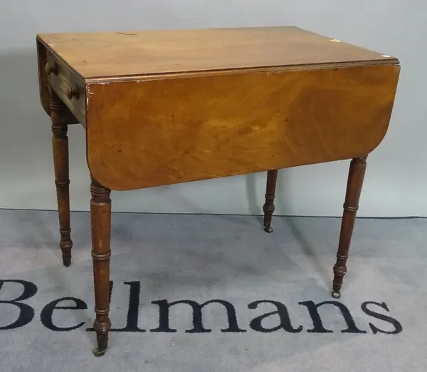 A Victorian mahogany drop flap Pembroke table on turned supports, 83cm wide x 74cm high.