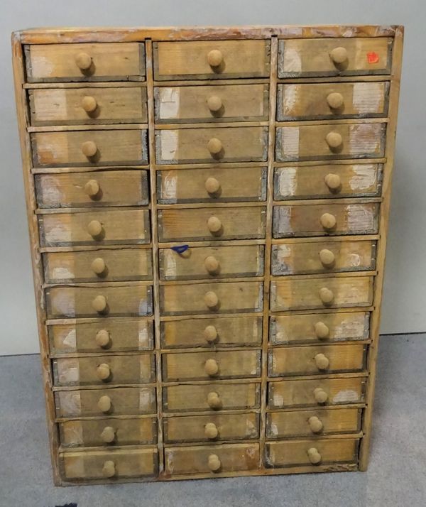 An early 20th century pine collectors chest, of three short drawers, 45cm wide x 61cm high.