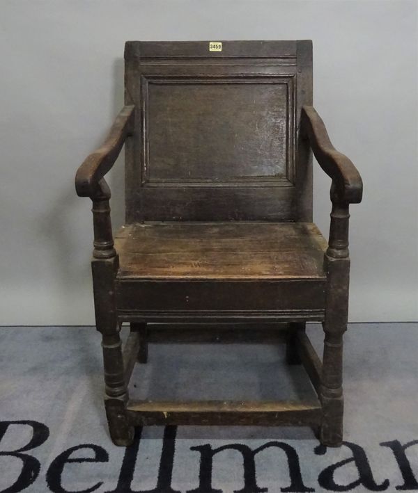 An 18th century and later oak open armchair, 53cm wide x 90cm high.