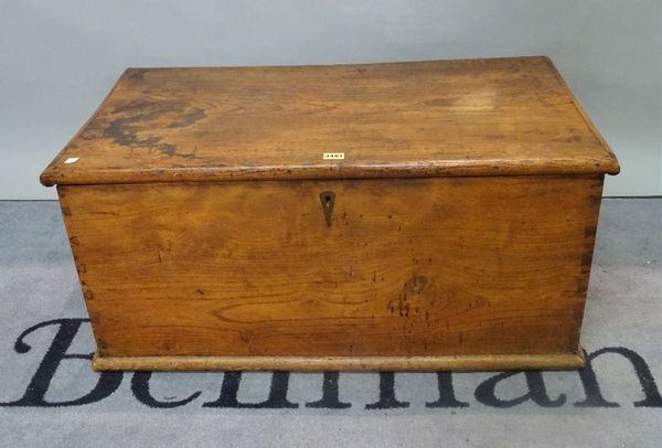 A 19th century elm lift top trunk, 85cm wide x 40cm high.