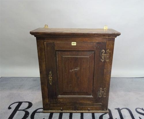 An 18th century and later oak hanging cupboard, 63cm wide x 72cm high, and another similar, 85cm wide x 82cm high, (2).