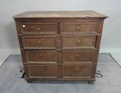 An early 18th century oak chest, of two short and three long graduated drawers, 97cm wide x 90cm high.