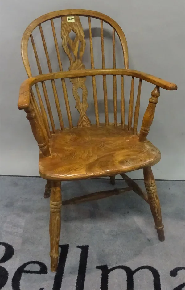 A 19th century ash and elm stickback open armchair, 55cm wide x 89cm high.