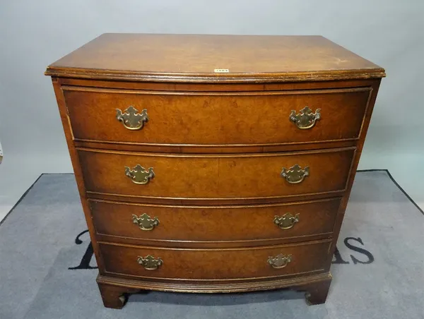 A Regency style walnut bowfront chest, of four long graduated drawers on bracket feet.