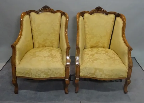 A pair of early 20th century beech framed tub chairs on cabriole supports, 61cm wide x 90cm high, (2).
