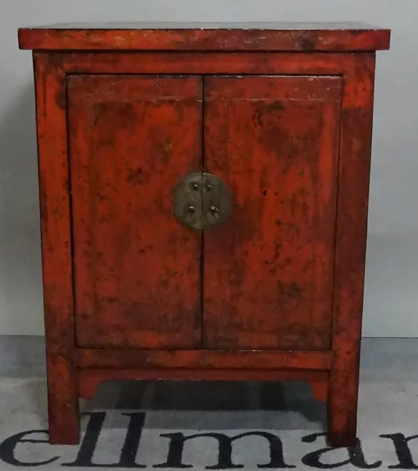 A modern black lacquer and red painted Chinese side cupboard, 65cm wide x 80cm high.