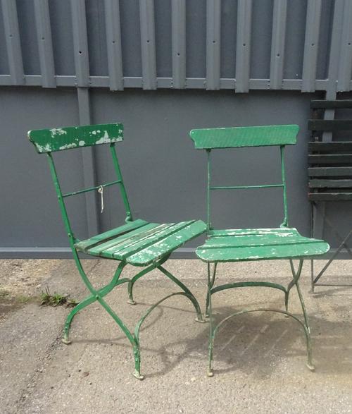 A pair of early 20th century green painted folding garden chairs, (2).