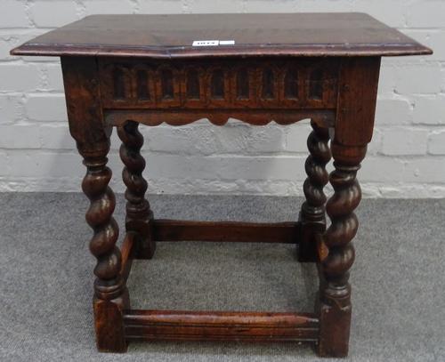 A 17th century and later oak joint stool, with carved frieze on barley twist supports, 51cm wide x 50cm high.
