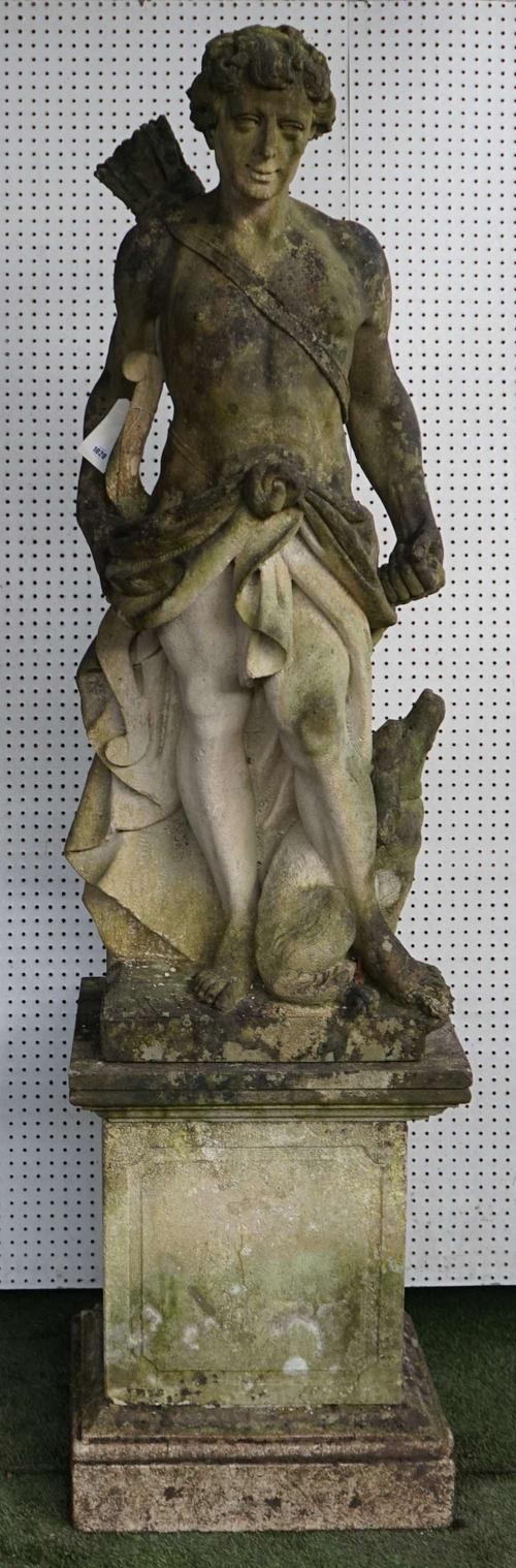 A Vicenza stone figure of a standing Apollo the hunter with bow and dog, on a plinth base, 241cm high.