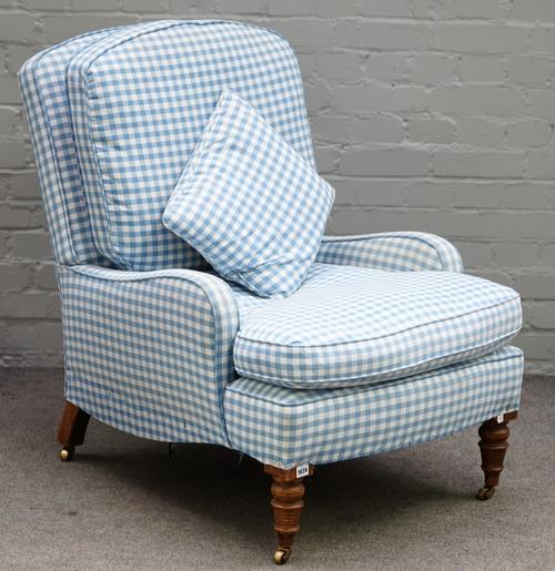 A Victorian oak framed easy armchair, with blue gingham upholstery, on turned supports, 71cm wide x 92cm high.