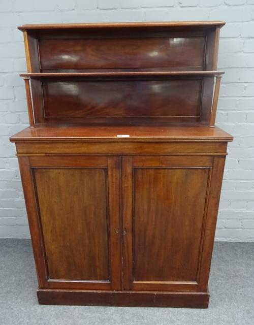 A Regency mahogany chiffonier, the two tier shelf back over pair of cupboards on plinth base, 94cm wide x 143cm high.