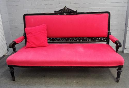 A 19th century French Aesthetic Movement, brass and mother-of-pearl inlaid ebonised open arm sofa on turned supports, 161cm wide x 103cm high.