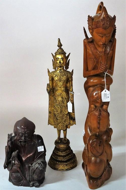 A Thai gilt bronze figure of Buddha, late 19th century, standing with hands held in abhaya mudra on a tiered octagonal base, 45cm high; also a...