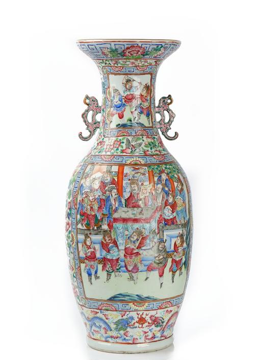 A Chinese famille-rose two-handled baluster vase, 19th century, painted on one side with a large panel depicting a battle scene, the reverse with...