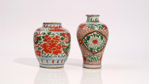 A Chinese wucai ovoid vase, 17th century, painted with two pheasants amongst peonies, 16.5cm high; and another wucai baluster vase painted with...
