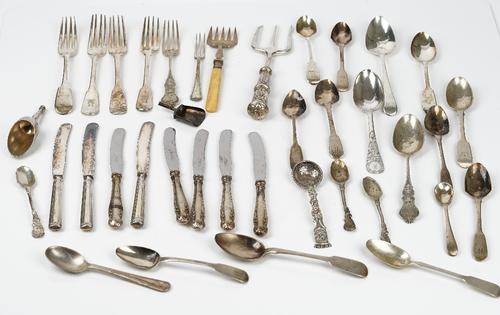 A group of silver flatware, comprising; four fiddle pattern dessert forks, a Christening spoon and fork, part of a caddy spoon and twelve further...