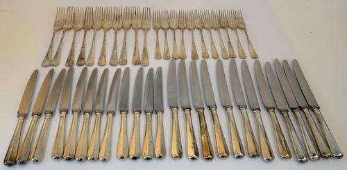 A silver rat tail pattern part table service, comprising; eleven table forks, four serving spoons, twelve dessert forks, one sauce ladle, twelve...