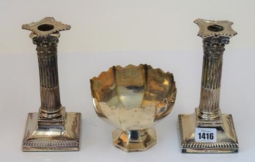 A pair of late Victorian silver candlesticks each designed as a Corinthian column, raised on a square base, London 1899, height 18.5cm and an Indian...