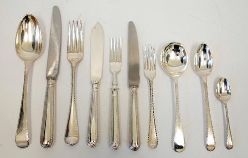 A collected George III Old English feather edge pattern silver canteen, for twelve persons, varying dates, third and fourth quarters 18th century,...