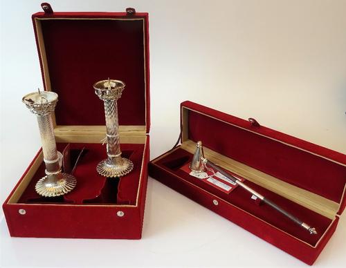 A pair of Frazer & Haws Sterling silver pricket candlesticks, each with a fluted column, the tops with pierced floral and foliate motifs and raised...