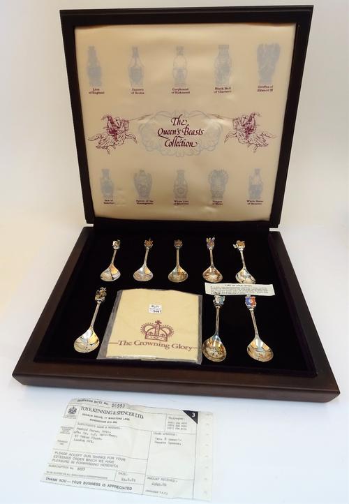A set of ten silver and enamelled spoons, detailed within the lid of the fitted case, The Queen's Beasts' Collection, each spoon having a pear shaped...