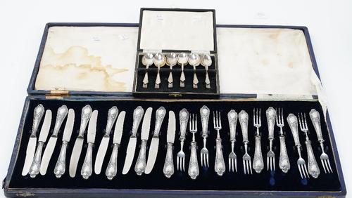 A set of six silver teaspoons, Sheffield 1975, a set of six silver coffee spoons, Birmingham 1961, combined weight 130 gms, with a case to hold one...