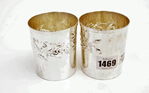 A pair of European silver beakers, decorated with floral and foliate bands, detailed 925, height 7.8cm, combined weight 174 gms, with a box.