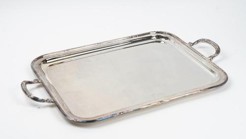 A plated rectangular twin handled tray, decorated with reeded rims, with crossover motifs, width including handles 67cm and a Etains Du Manoir plated...