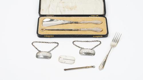 Silver and silver mounted wares, comprising; two decanter labels detailed Claret and Port, probably London 1820 and 1821, a button hook and matching...