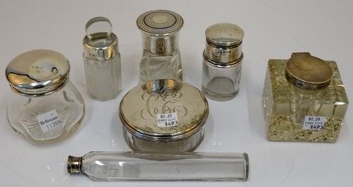 A group of silver mounted glassware, comprising; a late Victorian square inkstand, London 1899, a circular toilet box and cover, London 1829, a...