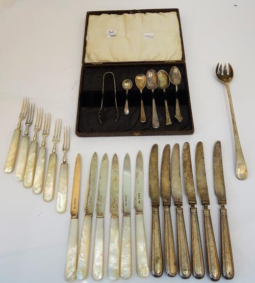A set of six pairs of silver desert or fruit knives and forks, having mother-of-pearl handles, Sheffield 1926 and a small group of further mostly...