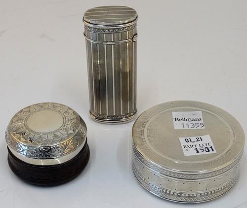 A silver oval hinge lidded case, with banded decoration within engraved rims, length 7.8cm, import mark London 1923, a silver circular box and cover,...