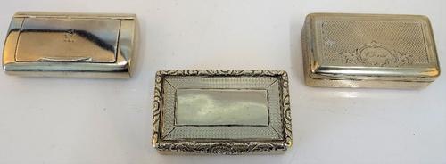 A George III silver curved rectangular snuff box, London 1803, a George IV silver rectangular snuff box, with engine turned decoration, Birmingham...