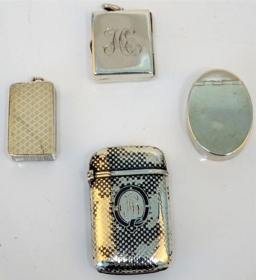 A George III silver oval hinge lidded box, the exterior plain, probably London 1801, a silver rectangular postage stamps case, the front monogram...