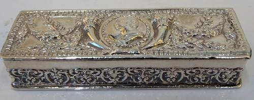A silver rectangular hinge lidded box, the cover decorated with a portrait between two cornucopia, otherwise decorated with floral pendant swags, the...