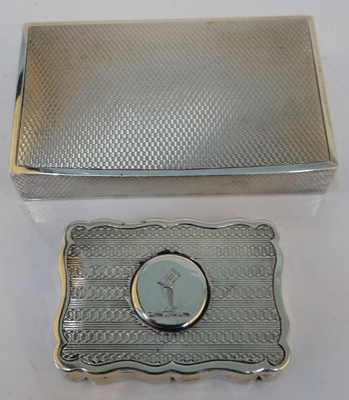 A silver rectangular hinge lidded box, the interior gilt, the exterior engine turned, length 8cm, London 1926 and a late Victorian silver shaped...