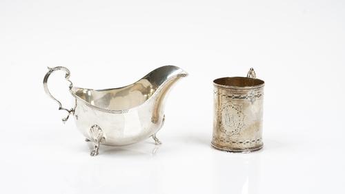 A Victorian silver Christening mug, decorated with engraved bands and with a foliate capped scrolling handle, London (date letter indistinct), height...