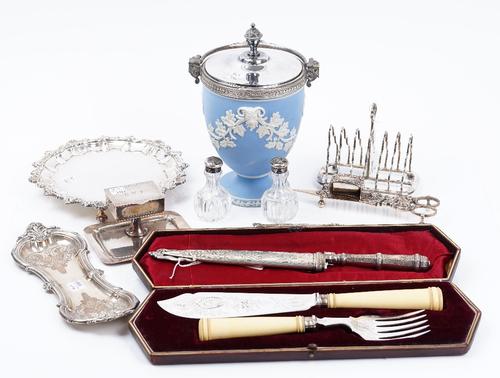 A group of plated wares, comprising; a blue and white Jasperware urn shaped bowl with a plated detachable cover and swing over handle, a pair of fish...