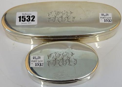 A late Victorian silver oval hinge lidded box, gilt within, monogram engraved, length 17.5cm, London 1900 and another silver oval hinge lidded box,...